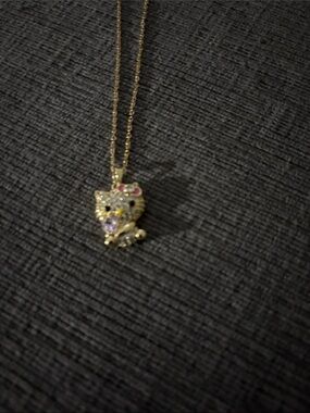 Gold Tone hello kitty Pendant Necklace with Pink Accent